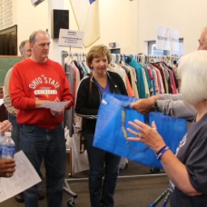 Volunteers from the Twice Blessed store speak to the Cabinet